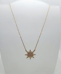 collana in acciaio inossidabile dorata con sole con brillantini