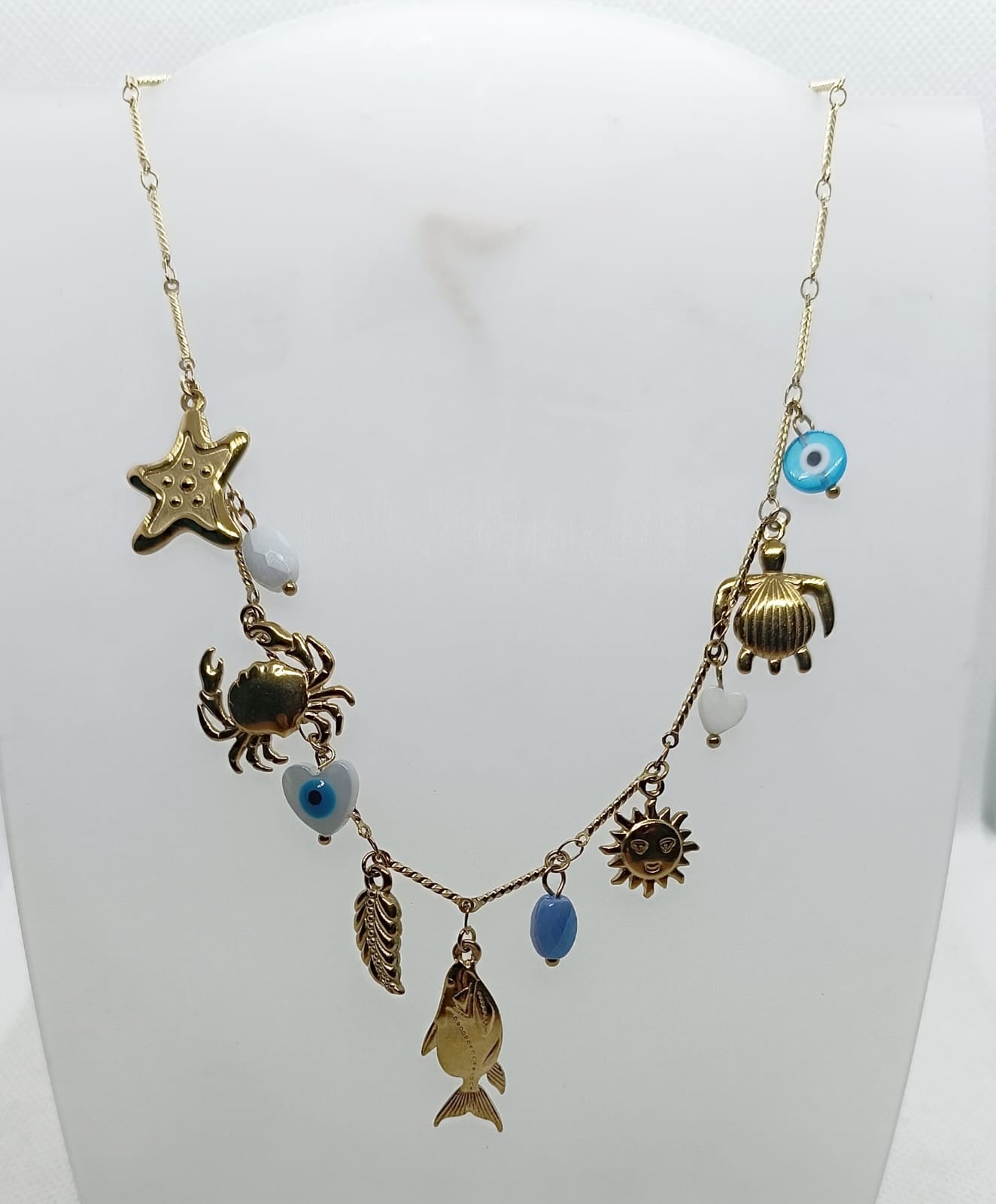 collana in acciaio inossidabile dorata e ciondoli motivo mare